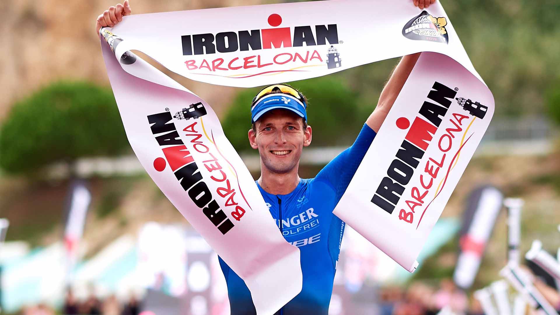 Florian Angert holding a banner